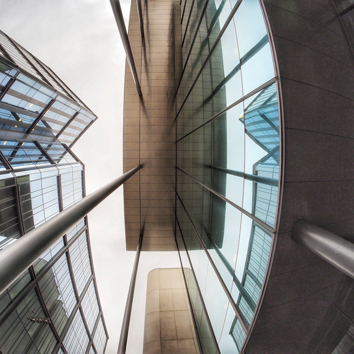Photo by Richard Williams Modern glass buildings viewed from below